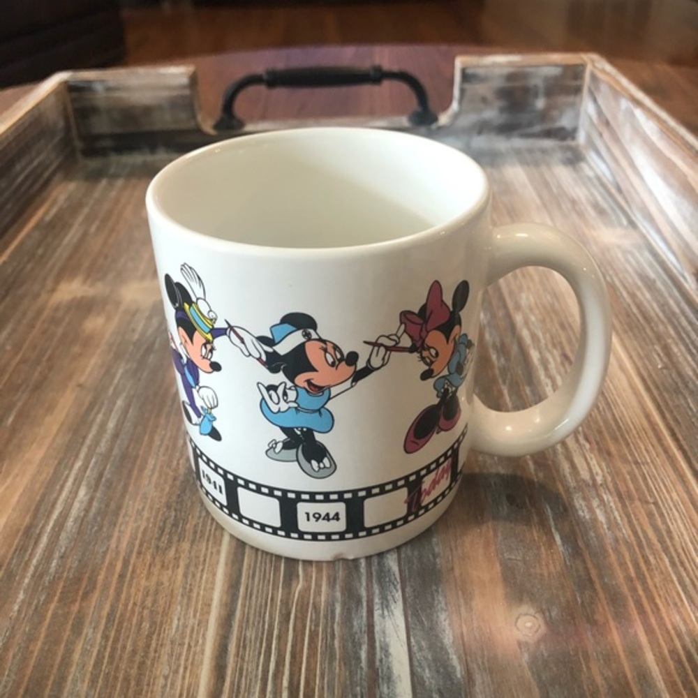 Vintage Disney Minnie Through the Years Mug Applause.  Small chip, see pictures.